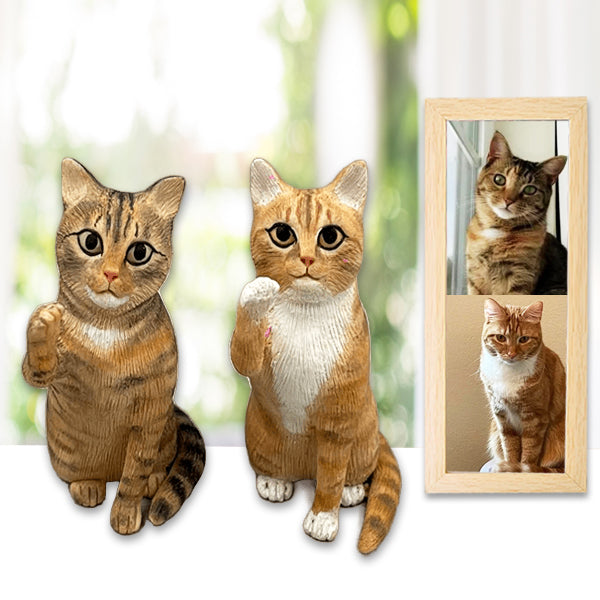 Two handcrafted cat cake toppers resembling cats